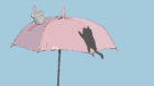 傘につかまる黒猫のイラスト